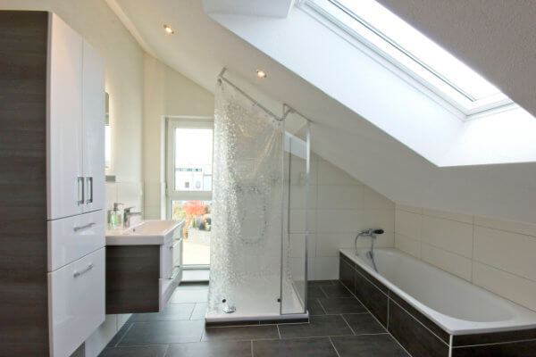 Modern renovated bathroom with bathtub and shower